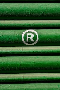 IP Services for Indian Startups 2 Close-up of green shutter with registered trademark symbol in white.